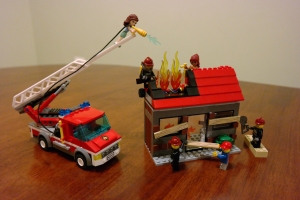 LEGO fire being put out by team